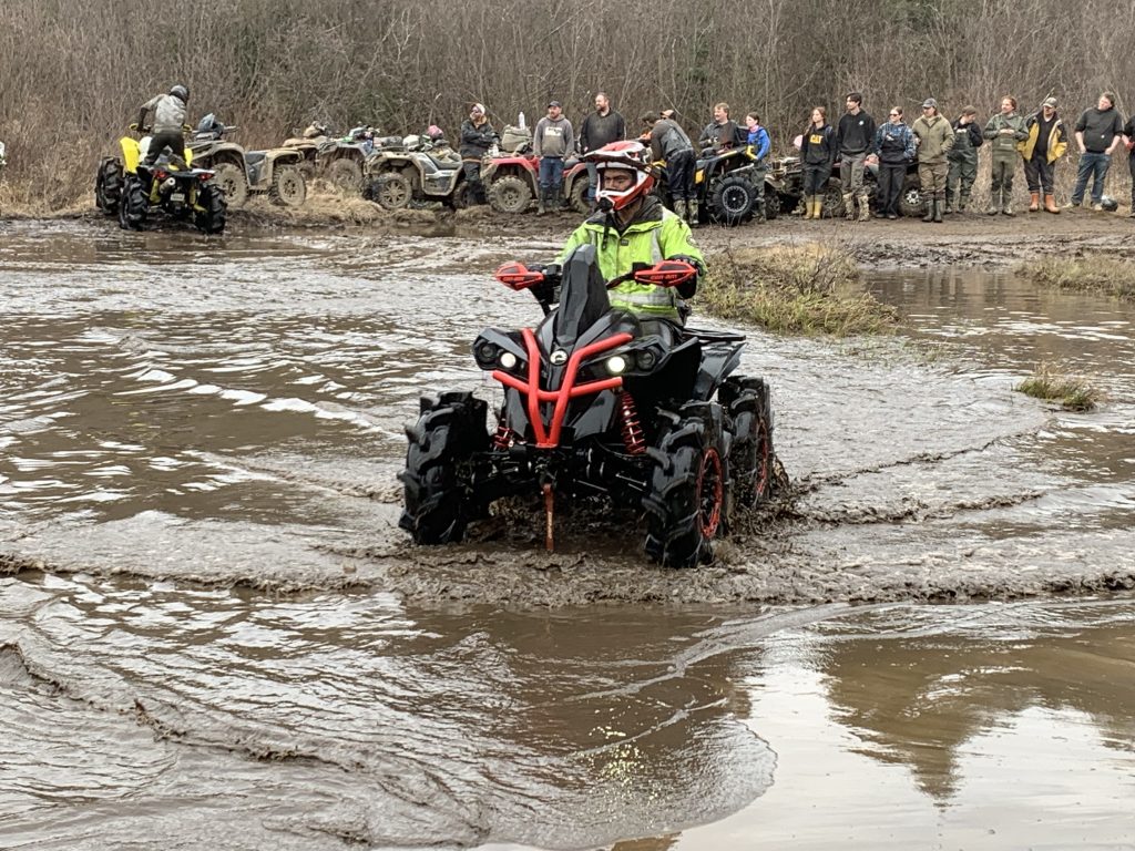 Crowd watching mud runner